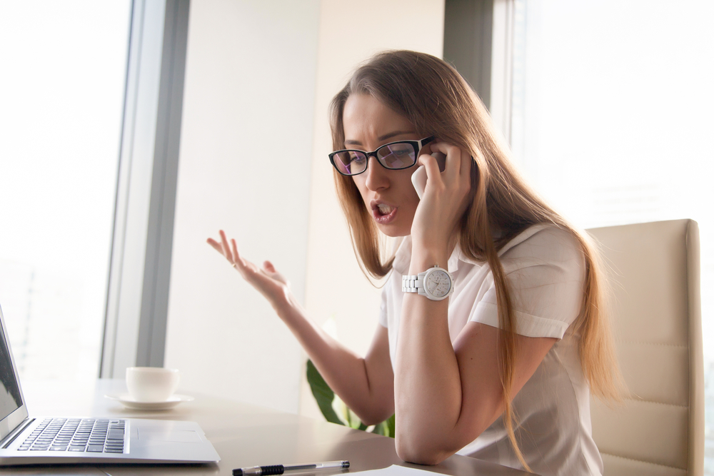 Angry,Confident,Businesswoman,Arguing,While,Talking,On,Phone,Annoyed,Woman